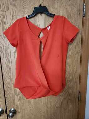 Grace Twist-Front Short Sleeve Blouse in Orange. Small Spot On The Front
